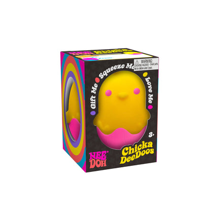 A yellow chick-shaped sensory toy called "Chicka DeeDoos" by , packaged in a black box with colorful accents. The chick has pink cheeks and beak, and the text on the box reads, "Gift Me, Squeeze Me, Love Me". The toy is for ages 3 and up.
