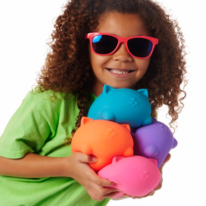 Super Cool Cats - Lifestyle with girl holding all four colors Super Cool Cats