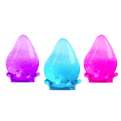 Three sensory toys are displayed. They are shaped like teardrops and have a gradient design: the left is purple, middle is blue, and right is pink. Each sits in a translucent, splash-like base.