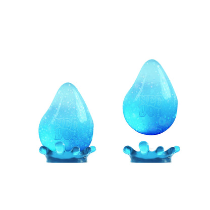 Two blue, water droplet-shaped sensory toys with a gradient designe. One is positioned upright, and the other is showing a splash-like shape at the base. Both are set against a plain white background.
