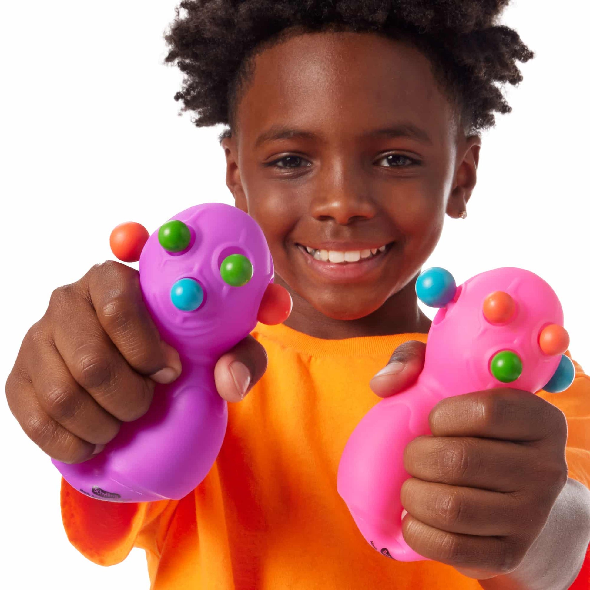 Panic Pete Lifestyle with boy squeezing purple and pink Panic Petes
